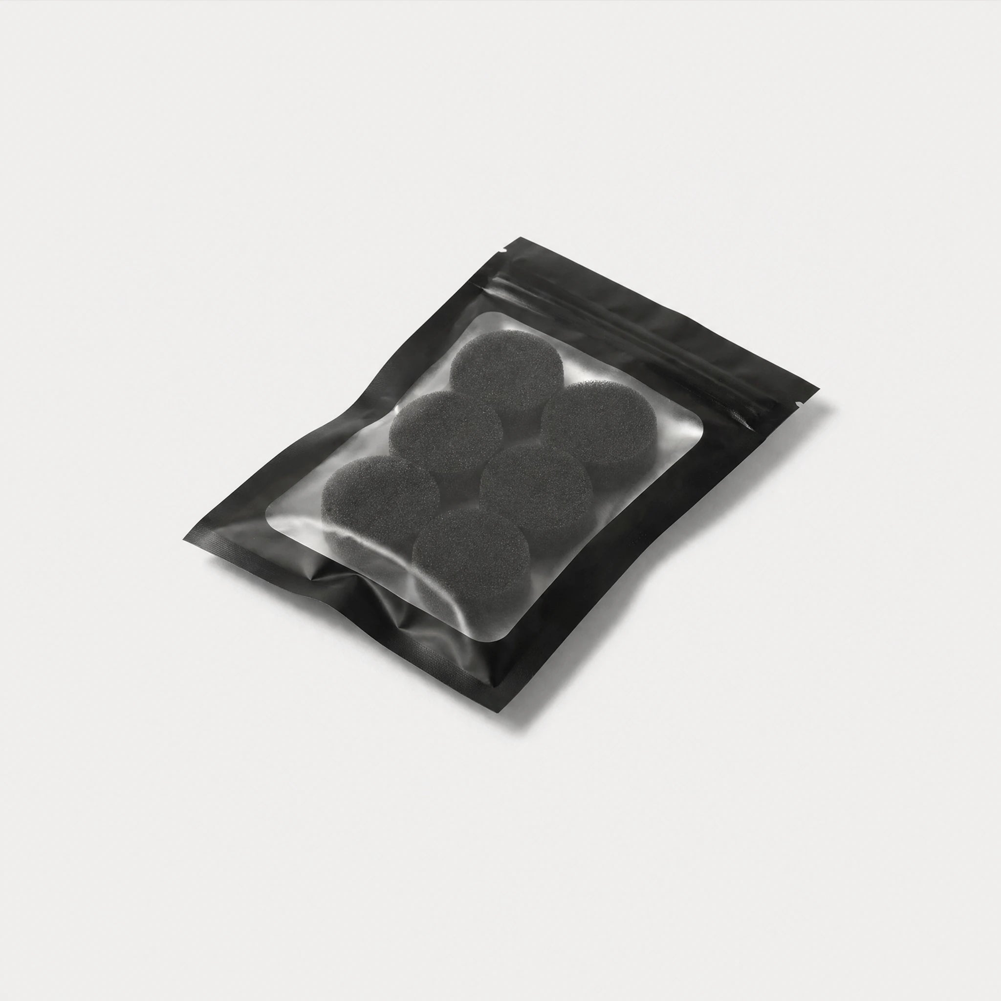 Six-pack of Kuvola replacement HME foam filters, top-down view