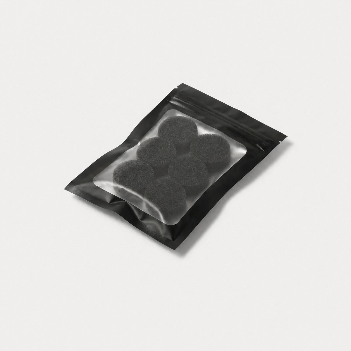 Six-pack of Kuvola replacement HME foam filters, top-down view