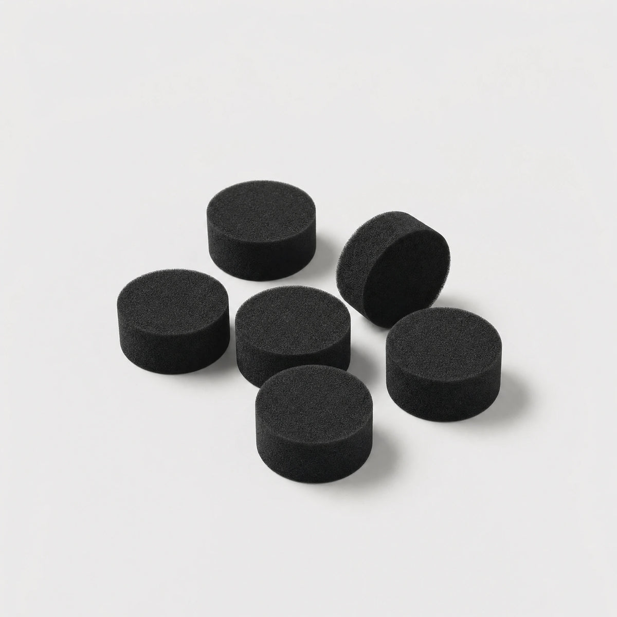 Six replacement HME foam filters arranged in their packaging